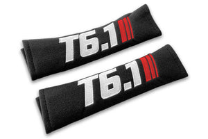 T6.1 Stripes logo embroidered on padded seat belt covers shown in black with white and red embroidery.