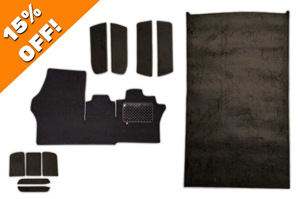 ID Buzz Cargo mat set for a 2 plus 1 cab seat arrangement showing cab mat side step mats dash liner mats mat and load space mat all in black automotive carpet with black trim