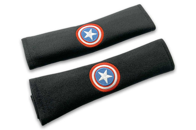 American Shield logo embroidered seat belt covers shown in black with red white and blue embroidery