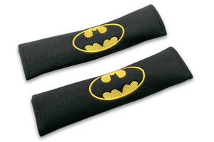 Bat logo embroidered seat belt covers shown in black with yellow embroidery