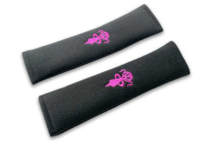 VW Bobblehead Kids logo embroidered seat belt covers shown in black with 2 pink girls embroidery