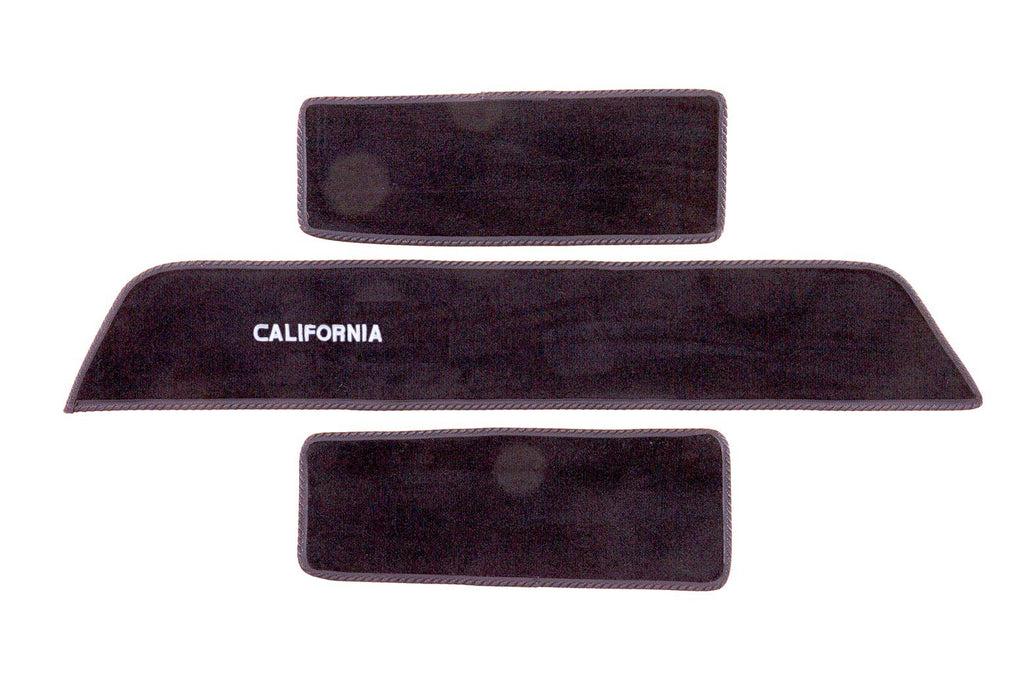 Transporter California side step mat set shown in black automotive carpet with white embroidered California logo