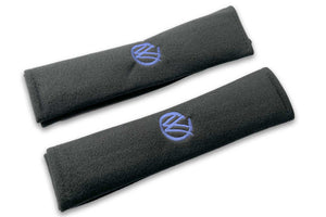 VW Graffiti logo embroidered seat belt covers shown in black with blue embroidery