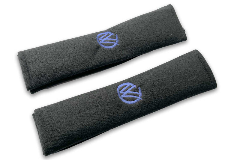 VW Graffiti logo embroidered seat belt covers shown in black with white embroidery