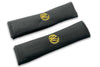 VW Graffiti logo embroidered seat belt covers shown in black with yellow embroidery