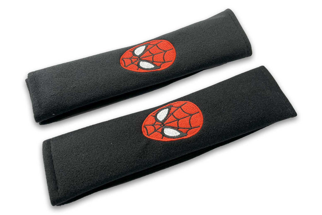 Spider Face logo embroidered seat belt covers shown in black with red , black and white embroidery