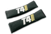 T4 Stripes logo embroidered on padded seat belt covers shown in black with white and cream embroidery.
