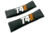 T4 Stripes logo embroidered on padded seat belt covers shown in black with white and orange embroidery.