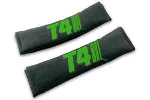 T4 Stripes single colour logo embroidered on padded seat belt covers shown in black with green embroidery.