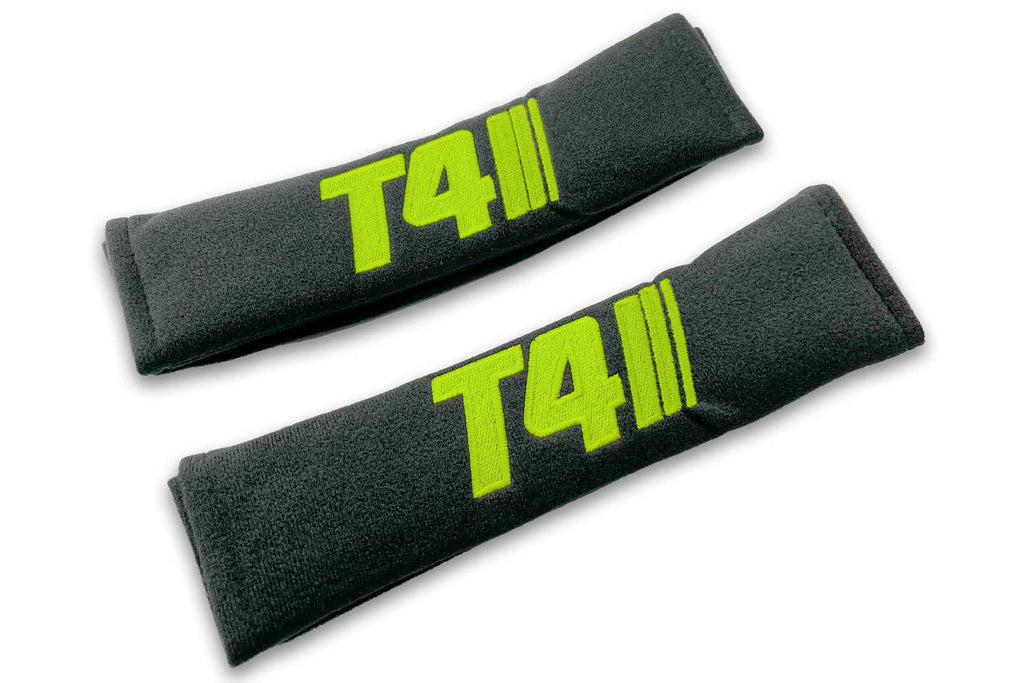 T4 Stripes single colour logo embroidered on padded seat belt covers shown in black with lime green embroidery.