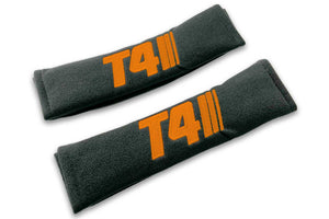 T4 Stripes single colour logo embroidered on padded seat belt covers shown in black with orange embroidery.