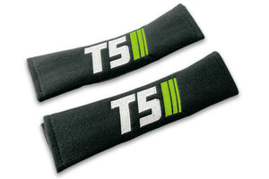 T5 Stripes logo embroidered on padded seat belt covers shown in black with white and lime green embroidery.