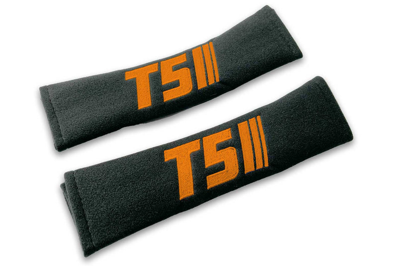 T5 Stripes single colour logo embroidered on padded seat belt covers shown in black with orange embroidery.