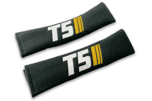 T5 Stripes logo embroidered on padded seat belt covers shown in black with white and yellow embroidery.