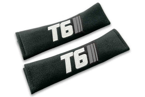 T6 Stripes logo embroidered on padded seat belt covers shown in black with white and grey embroidery.