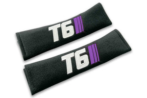 T6 Stripes logo embroidered on padded seat belt covers shown in black with white and purple embroidery.