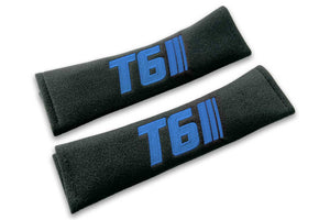 T6 Stripes single colour logo embroidered on padded seat belt covers shown in black with blue embroidery.