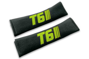 T6 Stripes single colour logo embroidered on padded seat belt covers shown in black with lime green embroidery.