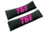 T6 Stripes single colour logo embroidered on padded seat belt covers shown in black with pink embroidery.