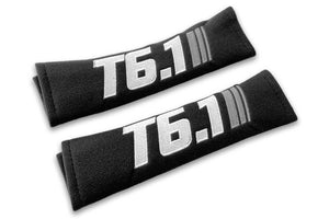 T6.1 Stripes logo embroidered on padded seat belt covers shown in black with white and grey embroidery.