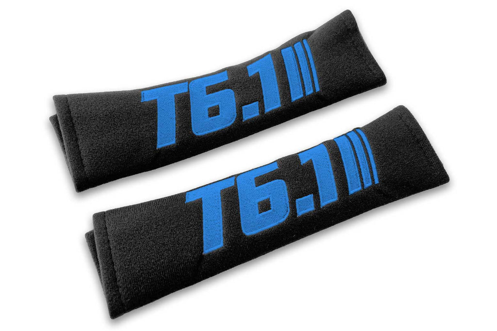 T6.1 Stripes single colour logo embroidered on padded seat belt covers shown in black with blue embroidery.