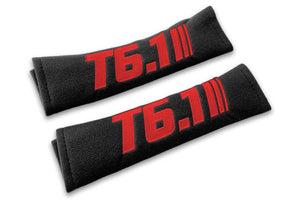 T6.1 Stripes single colour logo embroidered on padded seat belt covers shown in black with red embroidery.