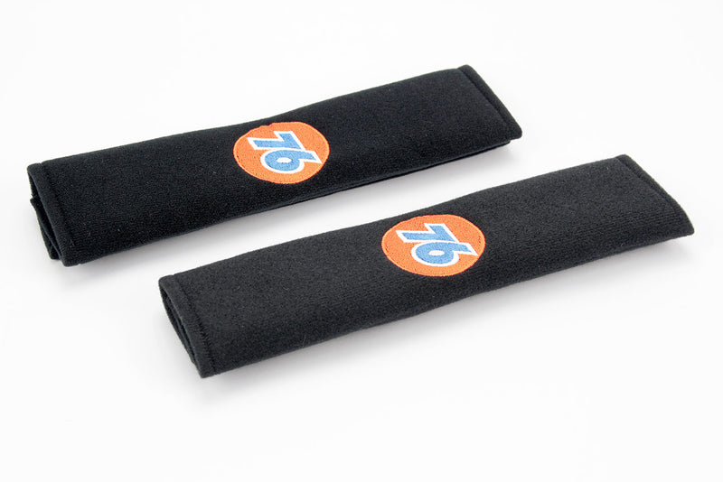 76 Gasoline logo embroidered on padded seat belt covers.
