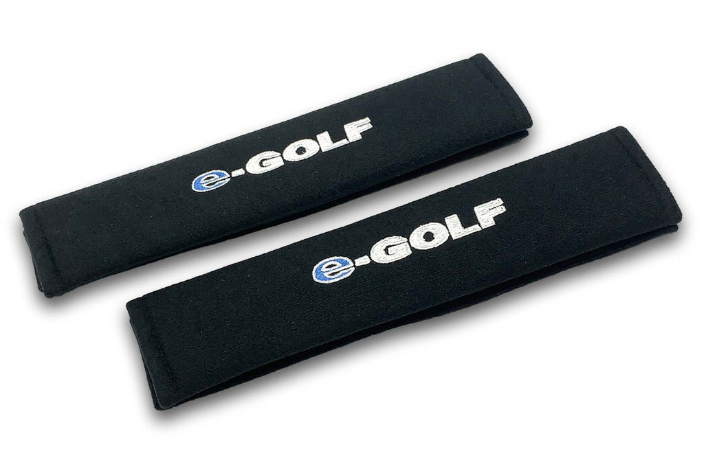 E Golf embroidered seat belt covers shown in black with blue and white embroidery