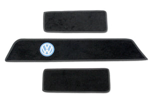 T5 side steps mats with classic blue VW embroidered logo shown on black automotive carpet