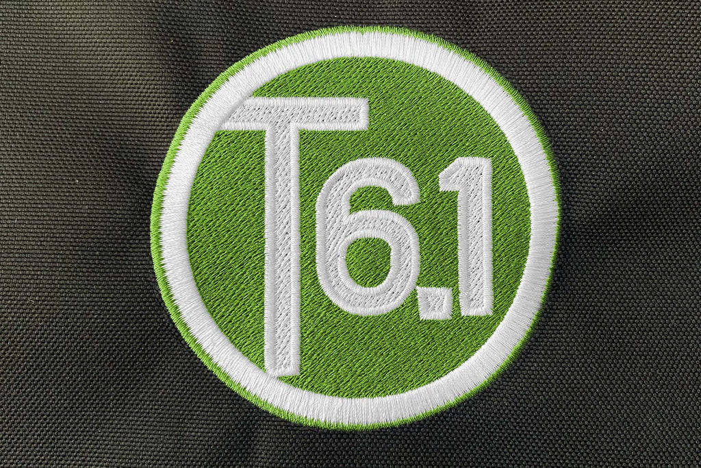 T6 point 1 embroidered circle logo with white text over a lime green background