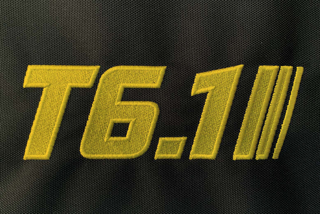 T6 point 1 embroidered logo with yellow text and stripe detail