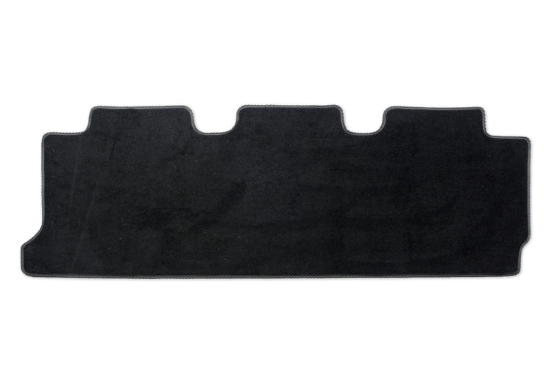 Kombi rear mat for triple seat and double slider door shown in black automotive carpet